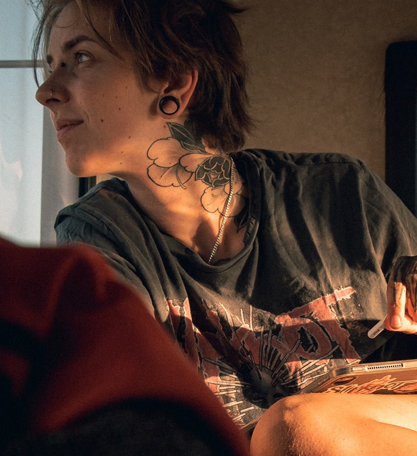 Avada Tattoo Gallery Woman with Tattoo in her Neck